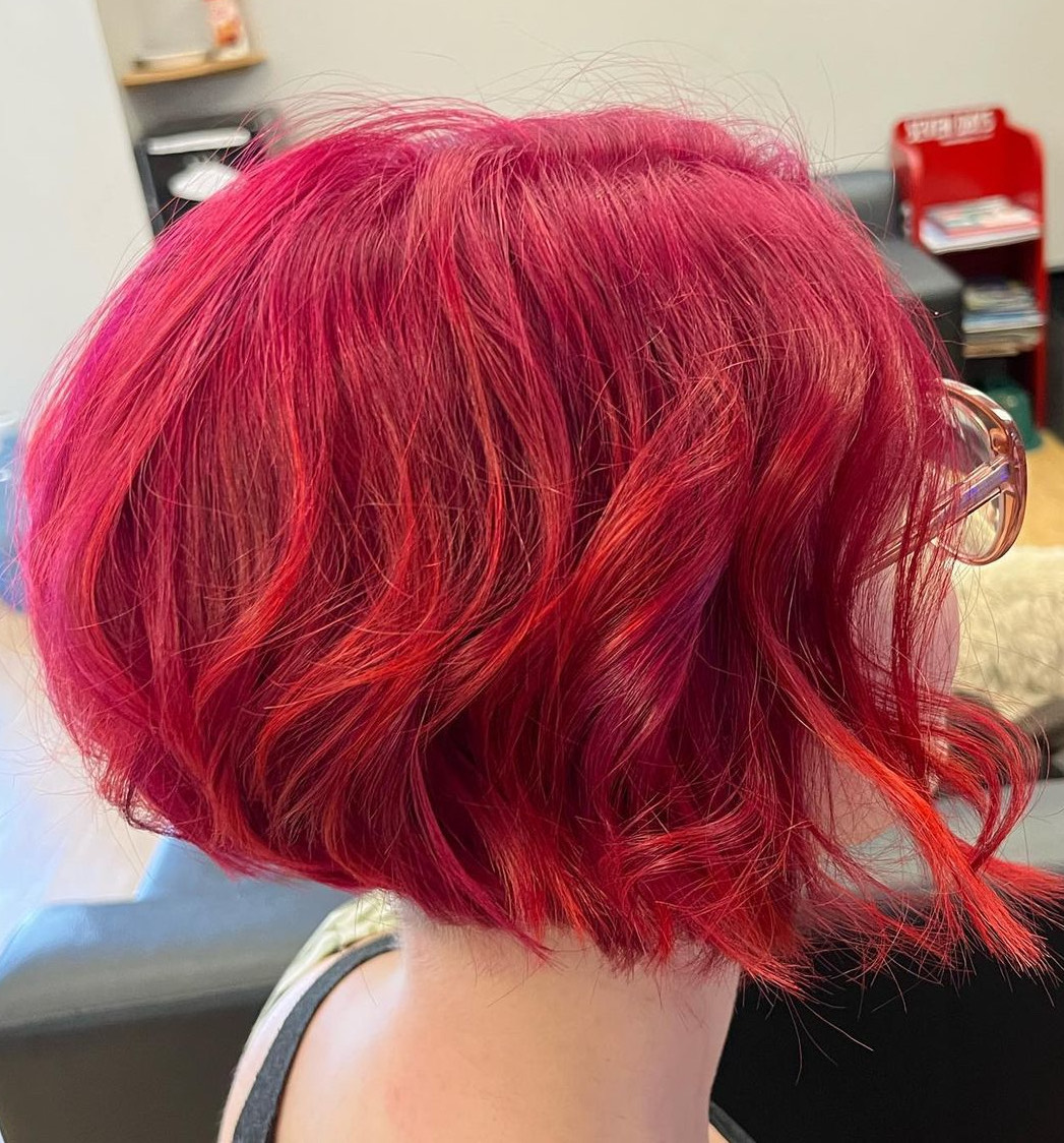 Short bright pink bob haircut